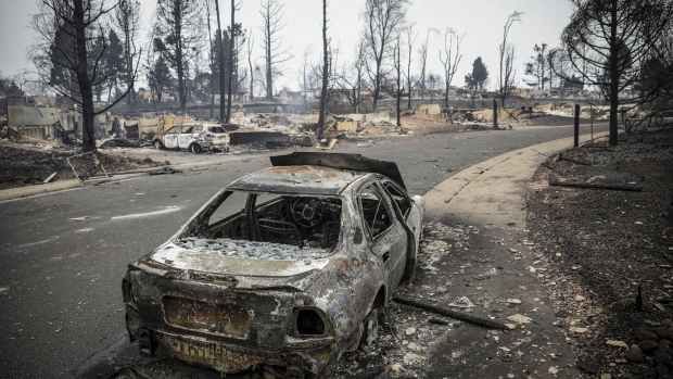 LOUISVILLE, CO - DECEMBER 31: The remains of a burnt out car stands amidst the remains of a neighborhood in the aftermath of the Marshall Fire on December 31, 2021 in Louisville, Colorado. Most every house in the neighborhood had burnt down to the foundation. The fast moving wind driven fire that erupted Thursday in multiple spots around Boulder County forced some 30,000 people out of their residences and may have destroyed as many as 1,000 homes. (Photo by Marc Piscotty/Getty Images)