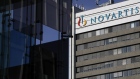 A logo sits on display on a building at the Novartis AG campus in Basel, Switzerland, on Wednesday, Jan. 16, 2019. Trying to streamline an operation that spends more than $5 billion a year on developing new drugs, Novartis dispatched teams to jetmaker Boeing Co. and Swissgrid AG, a power company, to observe how they use technology-laden crisis centers to prevent failures and blackouts. Photographer: Stefan Wermuth/Bloomberg