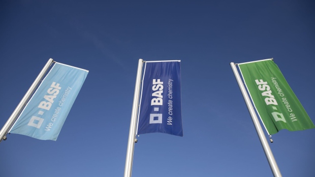 The BASF SE logo sits on banners flying outside the chemical company's headquarters in Ludwigshafen, Germany, on Tuesday, Feb. 26, 2019. BASF Chief Executive Officer Martin Brudermueller predicted a return to profit growth in 2019 on the condition U.S. trade conflicts ease and the economic fallout from Brexit is limited. Photographer: Alex Kraus/Bloomberg