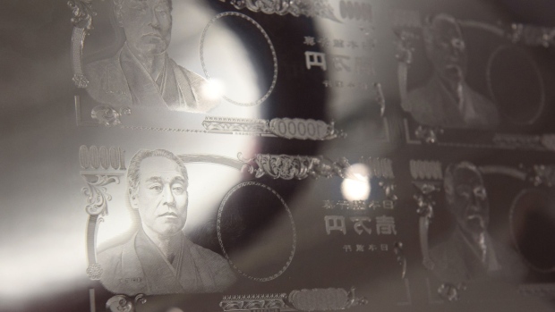 A printing plate for Japanese 10,000 yen banknotes is displayed at the National Printing Bureau Tokyo plant in Tokyo, Japan, on Monday, May 20, 2019. Japan’s unexpected growth spurt on the gross domestic product (GDP) in the first quarter masked weakness in the economy just as policy makers prepare to hike the sales tax in October. Photographer: Akio Kon/Bloomberg