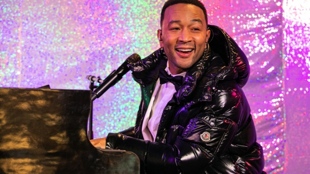 Musician John Legend performs during the Bloomingdale's Inc. holiday window unveiling event in New York, U.S., on Friday, Nov. 22, 2019. According to a survey from the National Retail Federation, Thanksgiving Day is expected to draw 13% more potential customers over last year.