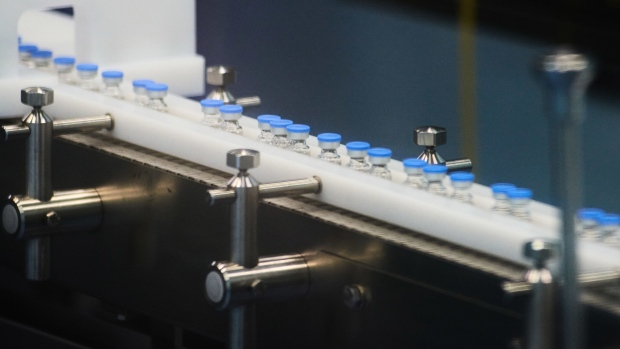 Vials move along a conveyor on the Johnson & Johnson Covid-19 vaccine production line during a media tour at the Aspen Pharmacare Holdings Ltd. plant in Gqeberha, South Africa, on Monday, Oct. 25, 2021. Aspen Pharmacare opened the southern hemisphere's largest general anesthetics manufacturing line, adding production at the South African plant where it fills and packages the Johnson & Johnson Covid-19 vaccine.