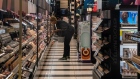 A worker arranges shelves at a beauty store in the Herald Square area of New York. Photographer: David Dee Delgado/Bloomberg