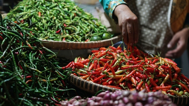 Chilies are displayed in baskets at a stall inside the Wonosari Market in Yogyakarta, Java, Indonesia, on Monday, April 10, 2017. Chili is a key marker for food inflation. It's in everything from the ubiquitous instant-noodle dinners to saucers of sambal paste at restaurants, and in the street food of the kaki-lima, or "five legs" that line the sidewalks of every town. Photographer: Dimas Ardian/Bloomberg