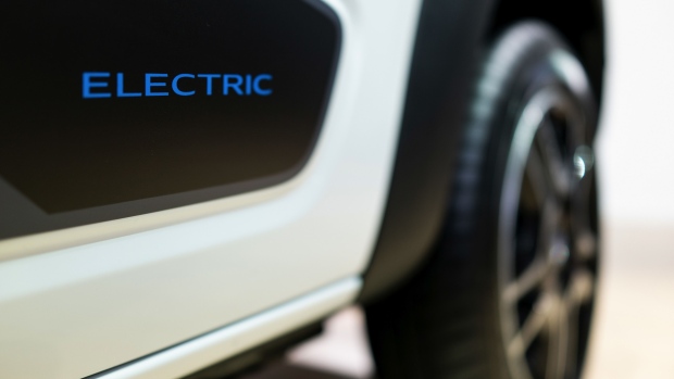 A body panel displays an 'electric' badge on a Dacia Spring crossover electric automobile, manufactured by Renault SA, sits on display during the automaker's E-Ways event in Paris, France, on Friday, Oct. 16, 2020. Renault SA’s promotional blitz for its growing electric lineup may be too late for the maker of Europe’s best-selling EV to stay atop the region’s expanding market for battery-powered cars. Photographer: Benjamin Girette/Bloomberg