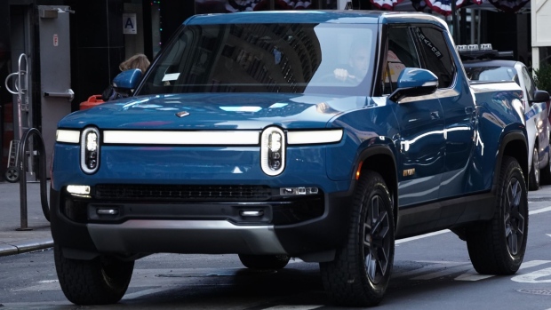 A Rivian R1T electric pickup truck during the company's IPO outside the Nasdaq MarketSite in New York, U.S., on Wednesday, Nov. 10, 2021. Electric vehicle-maker Rivian Automotive Inc. priced shares in its initial public offering at $78 apiece to raise about $11.9 billion, the biggest first-time share sale this year.