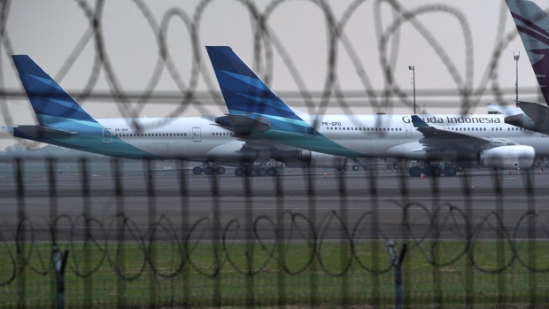 PT Garuda Indonesia aircraft parked at Soekarno-Hatta International Airport in Cengkareng, Indonesia, on Monday, May 24, 2021. Garuda Indonesia needs to completely restructure its business, potentially reducing the number of planes it operates to less than half its main fleet as the airline seeks to survive the crisis wrought by the pandemic, its president told staff last week.