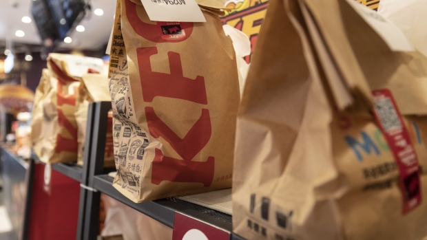 Take-out orders await collection in a KFC restaurant, operated by Yum China Holdings Inc., in Shanghai, China, on Thursday, Sept. 23, 2021. Yum China says it’s accelerating its store network expansion as the company aims to reach its 20,000 milestone. Photographer: Qilai Shen/Bloomberg