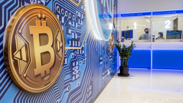 Signage for Bitcoin at the Hong Kong Digital Asset Exchange Ltd. digital currency trading store in Hong Kong, China, on Thursday, June 24, 2021. Hong Kong Digital Asset Exchange is a cryptocurrency platform and is the first to combine online and physical exchange in Hong Kong. Photographer: Paul Yeung/Bloomberg
