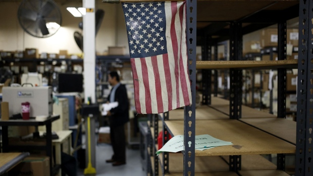 A American flag is displayed on a factory floor in Bowling Green, Kentucky. Photographer: Luke Sharrett/Bloomberg