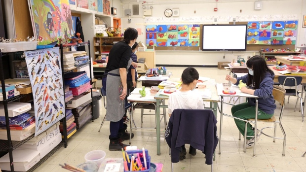 An art teacher at Yung Wing School P.S. 124, gives students a lesson in her classroom on January 05, 2022 in New York City. 