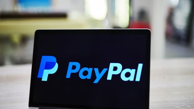 PayPal Holdings Inc. signage is displayed on an Apple Inc. laptop computer in an arranged photograph taken in Little Falls, New Jersey, U.S., on Saturday, July 20, 2019. Paypal Holdings Inc. is scheduled to release earnings figures on July 24. Photographer: Gabby Jones/Bloomberg