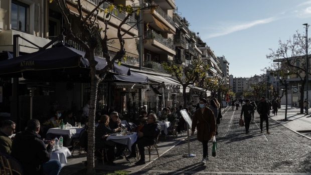 Customers dine outside at a cafe terrace in Athens, Greece, on Tuesday, Jan. 4, 2022. Greece announced new measures to support workers and companies affected by the latest curbs introduced to slow the spread of coronavirus.
