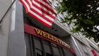 Signage at a Wells Fargo bank branch in San Francisco, California, U.S., on Monday, July 12, 2021. Wells Fargo & Co. is expected to release earnings figures on July 14. Photographer: David Paul Morris/Bloomberg
