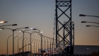 Trucks cross the Ambassador Bridge from Detroit, Michigan, into Windsor, Ontario.