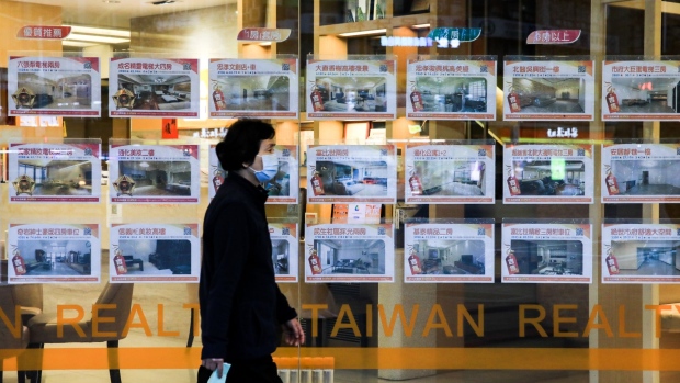 Housing listings at a property agency in Taipei, Taiwan, on Wednesday, Nov. 24, 2021. Taiwan, home to several major producers of leading-edge semiconductors, has been among the biggest beneficiaries of a global rebound in trade as the Covid-19 pandemic eases.