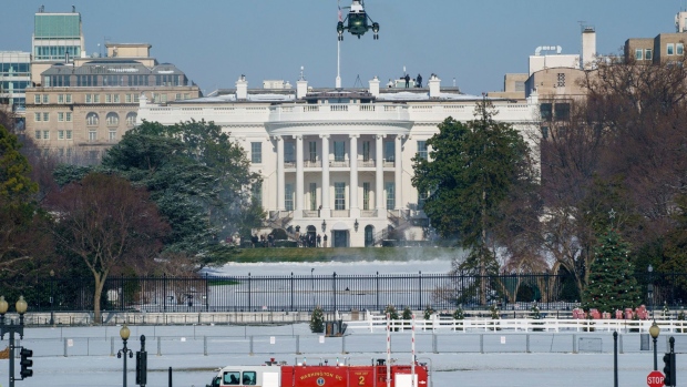 Marine One, carrying U.S. President Joe Biden, takes off from the South Lawn of the White House in Washington, D.C., U.S., on Friday, Jan. 7, 2022. The House and Senate will both be in session next week for the first time in 2022, and Democratic leaders in both chambers are searching for a path forward on voting rights legislation. Photographer: Ting Shen/Bloomberg