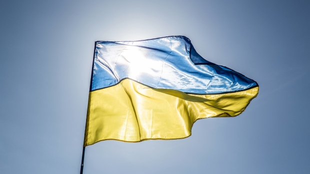 A Ukrainian flag flies at a political rally for Yulia Tymoshenko, former Prime Minister, not pictured, in Kiev, Ukraine, on Friday, March 29, 2019. Ukraine votes on Sunday in the first round of its presidential election. Photographer: Taylor Weidman/Bloomberg