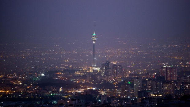 The Milad Tower stands on the illuminated city skyline seen from the Bam-e Tehran in Tehran, Iran, on Friday, Sept. 20. 2019. Iranian Foreign Minister Mohammad Javad Zarif refused to rule out military conflict in the Middle East after the U.S. sent more troops and weapons to Saudi Arabia in response to an attack on oil fields the U.S. has blamed on the Islamic Republic. Photographer: Ali Mohammadi/Bloomberg
