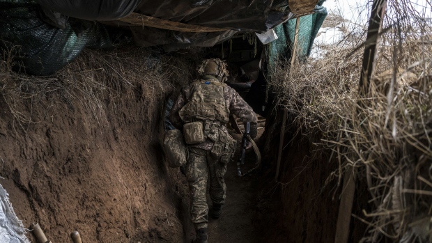 An Ukrainian soldier walks in a trench near the front line on January 17, 2022 in the village of New York, formerly known as Novhorodske, Ukraine.