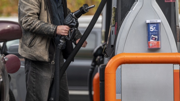 A customer holds a fuel pump nozzle at a 76 gas station in San Francisco, California, U.S., on Monday, Nov. 15, 2021. Gasoline pump prices hit a record in California as the most populace U.S. state grapples with the worst of a nationwide surge in energy prices ahead of the Thanksgiving holiday. Photographer: David Paul Morris/Bloomberg