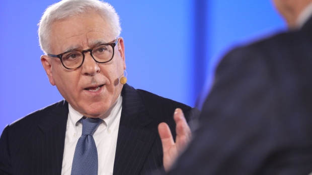 David Rubenstein, co-founder of the Carlyle Group Inc., speaks during an interview with Gina Raimondo, U.S. commerce secretary, at Economic Club of Washington event in Washington, D.C., U.S., on Tuesday, July 28, 2021. Raimondo made a fresh pitch for President Biden's plan to raise corporate taxes, saying lower rates have failed to have much impact and that the chief executive officers she speaks to privately are "much more reasonable" on taxes than the trade groups aggressively lobbying against increases. Photographer: Ting Shen/Bloomberg