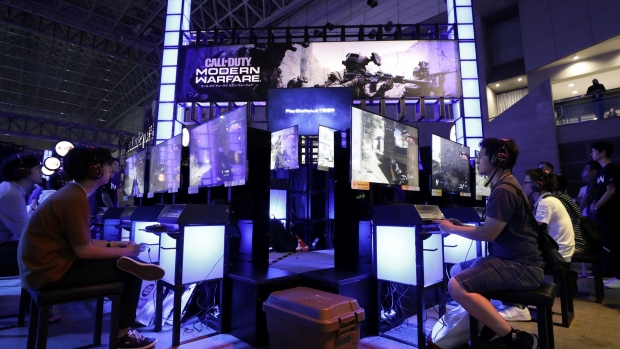 Attendees use Sony Corp. PlayStation 4 (PS4) game consoles to play the Call of Duty: Modern Warfare video game at the Tokyo Game Show 2019 in Chiba, Japan, on Thursday, Sept. 12, 2019. Over 650 companies and groups are exhibiting at the annual game show, which runs through Sept. 15.