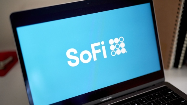 The logo for Social Finance (SoFi) on a laptop computer arranged in the Brooklyn borough of New York, U.S., on Friday, March 26, 2021. Social Finance Inc., the online lender that earlier this year reached a deal to go public, plans to offer its retail customers the ability to invest in initial public offerings. Photographer: Gabby Jones/Bloomberg