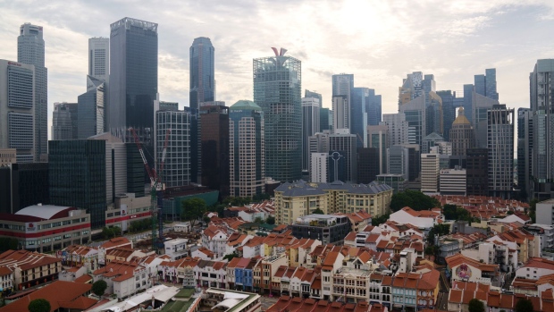 Shophouses and skyscrapers in the central business district of Singapore, on Sunday, Oct. 3, 2021. Singapore is looking to launch new vaccinated travel lanes by the end of the year and is in negotiations with several countries including those in Europe and also the U.S., Trade Minister Gan Kim Yong said, signaling continued caution even as other advanced economies open up. Photographer: Ore Huiying/Bloomberg