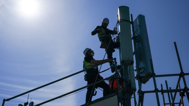 Engineers from the telecoms rigging team undertake on-site work to replace Huawei Technolgies Co. components with Nokia Oyj 5G network systems on the mobile network antenna array atop Muswell Court tower block in Hull, U.K., on Tuesday, April 20, 2021. Hull is the first British city where Huawei will be eradicated from the country's biggest network, BT Group Plc. Photographer: Ian Forsyth/Bloomberg