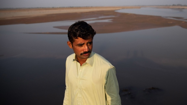Faqir Mohammad Warraich, 21, whose family received a notice last year that the government will acquire their agricultural land. Photographer: Betsy Joles/Bloomberg