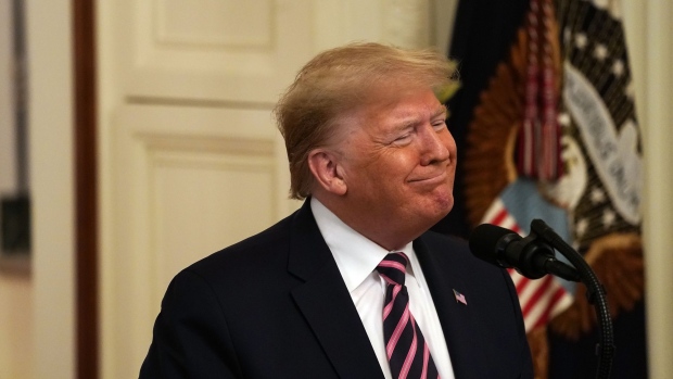 U.S. President Donald Trump smiles before speaking during an event at the White House in Washington, D.C., U.S., on Thursday, Feb. 6, 2020. Trump's acquittal by the Senate delivered an expected yet exhilarating victory to the White House, freeing a president who has for years operated under the threat of impeachment and longed for vindication. Photographer: Andrew Harrer/Bloomberg