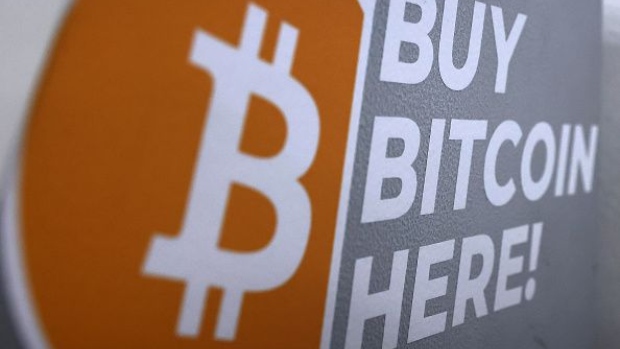 LOS ANGELES, CALIFORNIA - NOVEMBER 10: The Bitcoin logo is displayed on the side of a Bitcoin ATM on November 10, 2021 in Los Angeles, California. The price of the cryptocurrency hit a new record high today nearly breaking through $69,000 as inflation has risen to a level not seen in 30 years. (Photo by Mario Tama/Getty Images) Photographer: Mario Tama/Getty Images North America