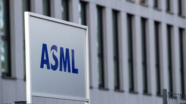A logo near the main gate at the ASML Holding NV manufacturing plant in Berlin, Germany, on Wednesday, Jan. 5, 2022. ASML shut a part of its German manufacturing site after a fire earlier this week, causing concern the closing could exacerbate a global chip shortage. Photographer: Krisztian Bocsi/Bloomberg