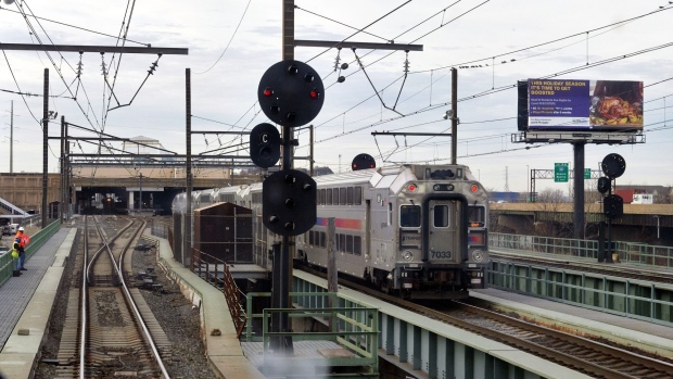 An New Jersey Transit train travels along the Northeast Corridor train tracks in Newark, New Jersey, U.S., on Thursday, Dec. 16, 2021. Amtrak's $12.3 billion plan to build a new commuter-train path under the Hudson River to Manhattan will take more than a decade to complete. In the meantime, it’s working to keep open the current tunnel.