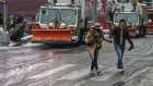 Pedestrians cross the street ahead of a snow plow New York, U.S., on Friday, Jan. 7, 2022. New York City experienced its first snow storm of the winter season with accumulations up to four inches in midtown Manhattan. Photographer: Stephanie Keith/Bloomberg