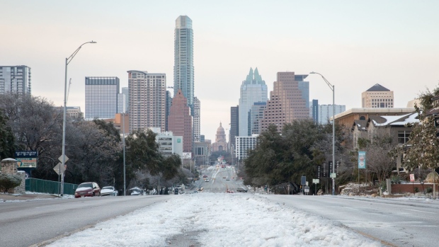 Snow and ice covers South Congress Avenue in Austin, Texas, U.S., on Thursday, Feb. 18, 2021. Texas is restricting the flow of natural gas across state lines in an extraordinary move that some are calling a violation of the U.S. Constitutions commerce clause.