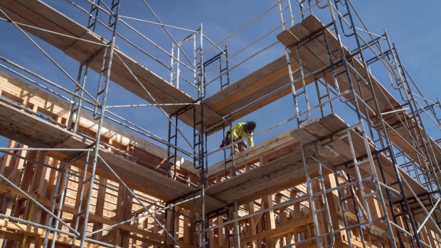 A worker builds framing during construction on a project for affordable housing at Brooklyn Basin in Oakland, California, U.S., on Tuesday, Nov. 12, 2019. About 15% of the new homes at the development in Oakland's Brooklyn Basin district -- an ambitious decade-long transformation of derelict land into a vibrant waterfront neighborhood -- will come at rents affordable to those left behind by the region's tech-fueled boom. Photographer: David Paul Morris/Bloomberg