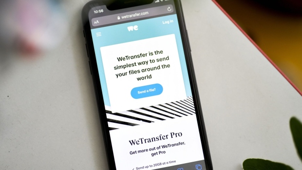 The WeTransfer website on a smartphone arranged in the Brooklyn borough of New York, U.S., on Wednesday, June 2, 2021. File-sharing platform WeTransfer plans to seek a valuation of about 1 billion euros ($1.2 billion) from a proposed initial public offering later this year, people familiar with the matter said.