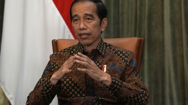 Joko Widodo, Indonesia's president, gestures as he speaks during an interview at Presidential Palace in Jakarta, Indonesia, on Wednesday, April 7, 2021. President Widodo is backing a push to expand Bank Indonesia’s mandate to include support for the economy, throwing his public support behind a legislative move that some analysts see as risking the central bank’s independence. Photographer: Dimas Ardian/Bloomberg