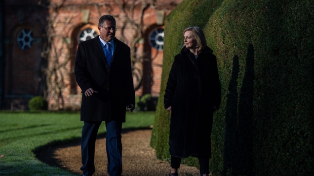 Maros Sefcovic, vice president of the European Commission, left, and Liz Truss, U.K. foreign secretary, walk in the gardens at Chevening House in Chevening, near Sevenoaks, U.K., on Thursday, Jan. 13, 2022. Truss enters the latest round of post-Brexit negotiations over Northern Ireland, facing a choice between picking a fight with the European Union that would curry favor with her Conservative Party faithful or cutting a deal to avert a trade war.