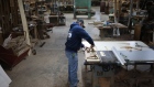 A worker assembles furniture at a wood shop in Auburn, Kentucky. Photographer: Luke Sharrett/Bloomberg