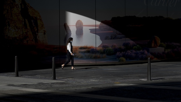 A pedestrian walks along a street in Sydney, on Dec. 29, 2021. Photographer: Brent Lewin/Bloomberg
