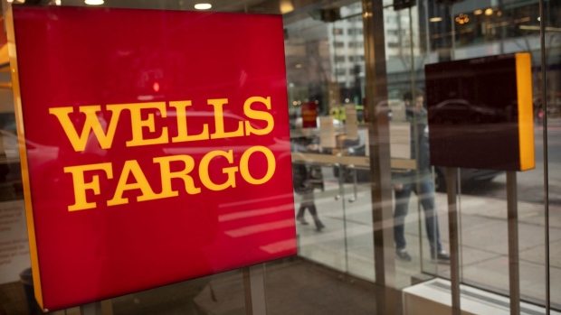 Signage at a Wells Fargo bank branch in New York, U.S., on Thursday, Jan. 13, 2022. Wells Fargo & Co. said it expects a key measure of lending to pick up this year, a sign that clients are starting to take on debt again as government stimulus wanes.