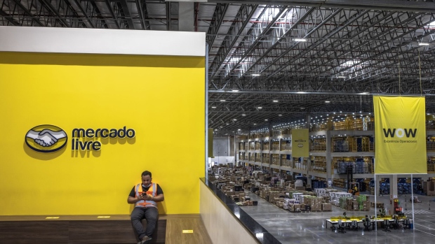 A worker takes a break at the MercadoLibre fulfillment center on Black Friday in Sao Paulo, Brazil, on Friday, Nov. 26, 2021. After a 2-year period in which Brazilians have greatly matured when it comes to online shopping, e-commerce platforms are ready for Black Friday.