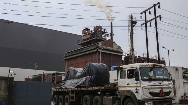 A truck carrying goods drives out of a JSW Steel Coated Products Ltd. plant at Maharashtra's Industrial Development Corporation (MIDC) industrial zone in Boisar, Maharashtra, India, on Sunday, Sept. 6, 2020. Six months after the start of the pandemic — as the developed world tries to restore some semblance of normalcy — the virus is arriving with a vengeance in India’s vast hinterland, where 70% of its more than 1.3 billion citizens live.