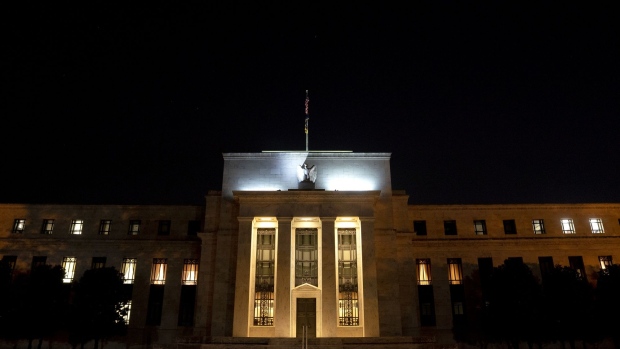 The Marriner S. Eccles Federal Reserve building at night in Washington, D.C.