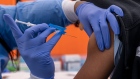 A healthcare worker administers a Pfizer-BioNTech Covid-19 vaccine to a child at a testing and vaccination site in San Francisco, California, U.S., on Monday, Jan. 10, 2022. California Governor Gavin Newsom is proposing a $2.7 billion Covid-19 emergency response package in his budget Monday to boost testing and its health-care system following a surge in cases caused by the omicron variant.