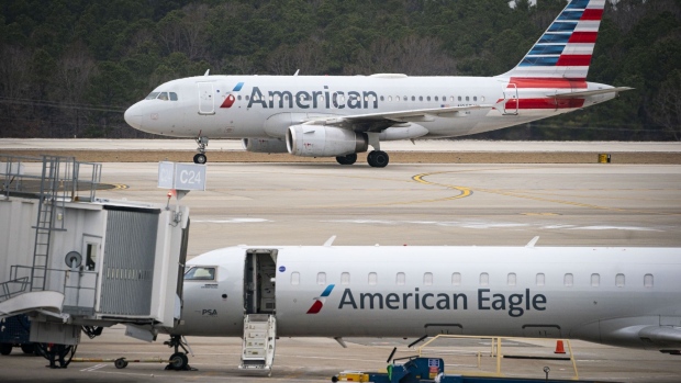An American Airlines Group planes arrives at Raleigh-Durham International Airport (RDU) in Morrisville, North Carolina, U.S., on Thursday, Jan. 20, 2022. For the third time in less than two months, the U.S. aviation system on Tuesday faced the threat of widespread flight disruptions over potential 5G interference, only to get a temporary reprieve. Photographer: Al Drago/Bloomberg