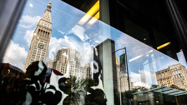 The Credit Suisse Group AG headquarters is seen reflected on a window in New York, U.S., on Wednesday, Sept. 19, 2018. Credit Suisse and UBS Group AG could manage a potential share sale of Stadler Rail AG as it explores a potential initial public offering.
